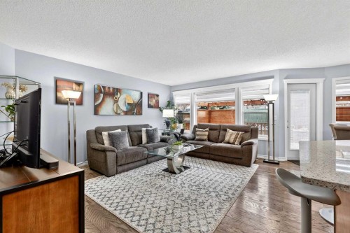 129 Bridlewood Way Sw, Calgary, AB - Indoor Photo Showing Living Room