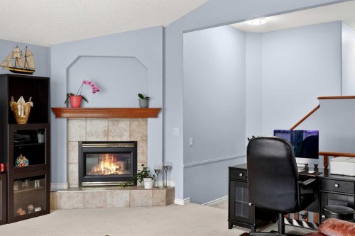 129 Bridlewood Way Sw, Calgary, AB - Indoor Photo Showing Office With Fireplace