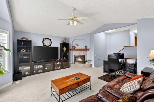 129 Bridlewood Way Sw, Calgary, AB - Indoor Photo Showing Living Room With Fireplace