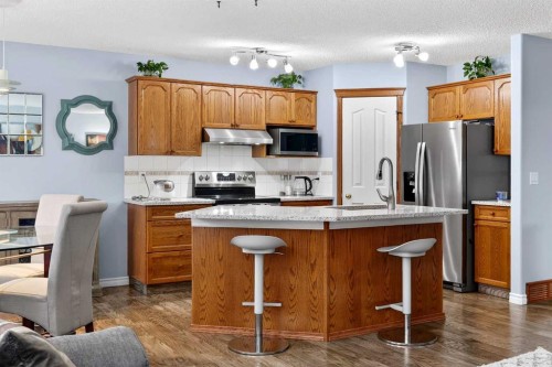129 Bridlewood Way Sw, Calgary, AB - Indoor Photo Showing Kitchen With Stainless Steel Kitchen