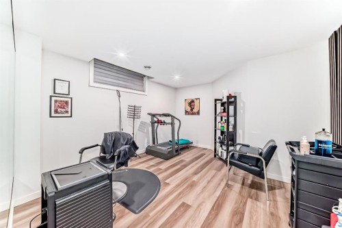 194 Willow Place, Cochrane, AB - Indoor Photo Showing Gym Room