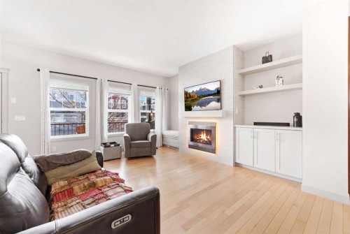 72 Evansdale Landing Nw, Calgary, AB - Indoor Photo Showing Living Room With Fireplace