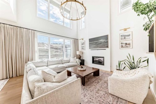 60 Cranbrook Cape Se, Calgary, AB - Indoor Photo Showing Living Room With Fireplace