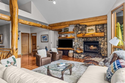 109 Silvertip Ridge, Canmore, AB - Indoor Photo Showing Living Room With Fireplace