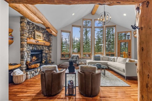 109 Silvertip Ridge, Canmore, AB - Indoor Photo Showing Living Room With Fireplace