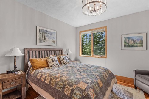 109 Silvertip Ridge, Canmore, AB - Indoor Photo Showing Bedroom