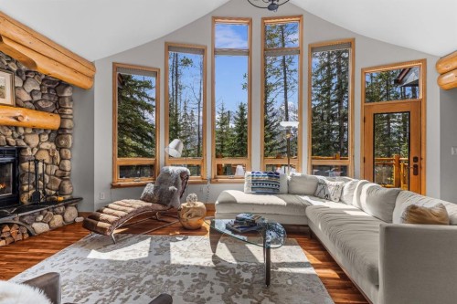 109 Silvertip Ridge, Canmore, AB - Indoor Photo Showing Living Room With Fireplace