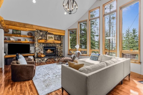 109 Silvertip Ridge, Canmore, AB - Indoor Photo Showing Living Room With Fireplace