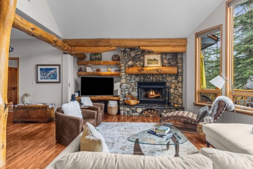 109 Silvertip Ridge, Canmore, AB - Indoor Photo Showing Living Room With Fireplace