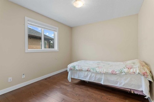 113 Aspen Stone Place Sw, Calgary, AB - Indoor Photo Showing Bedroom