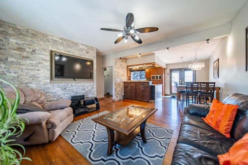 4604 Namaka Crescent Nw, Calgary, AB - Indoor Photo Showing Living Room With Fireplace