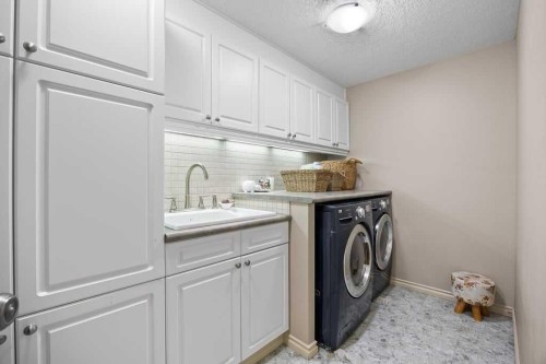4 Prominence Path Sw, Calgary, AB - Indoor Photo Showing Laundry Room