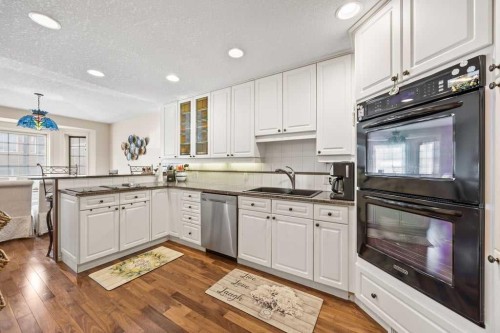 4 Prominence Path Sw, Calgary, AB - Indoor Photo Showing Kitchen With Double Sink With Upgraded Kitchen