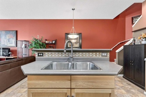 140 Promenade Way Se, Calgary, AB - Indoor Photo Showing Kitchen With Double Sink