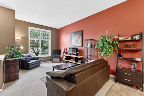 140 Promenade Way Se, Calgary, AB - Indoor Photo Showing Living Room