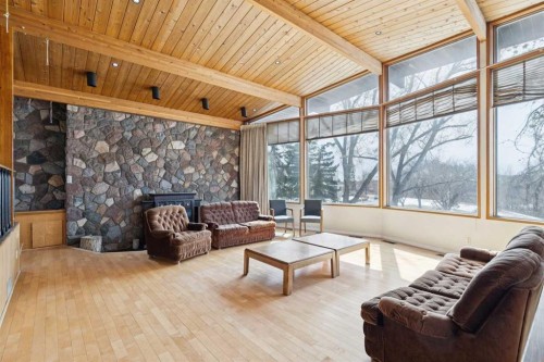 2925 Toronto Crescent Nw, Calgary, AB - Indoor Photo Showing Living Room With Fireplace