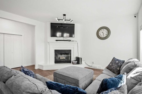 6005 Ash Street, Olds, AB - Indoor Photo Showing Living Room With Fireplace