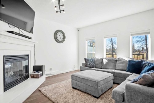 6005 Ash Street, Olds, AB - Indoor Photo Showing Living Room With Fireplace