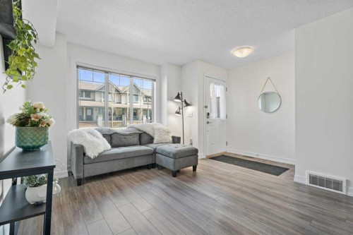 410-121 Copperpond Common Se, Calgary, AB - Indoor Photo Showing Living Room
