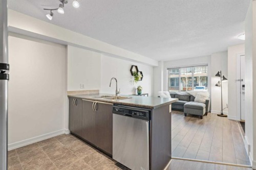 410-121 Copperpond Common Se, Calgary, AB - Indoor Photo Showing Kitchen With Stainless Steel Kitchen With Double Sink