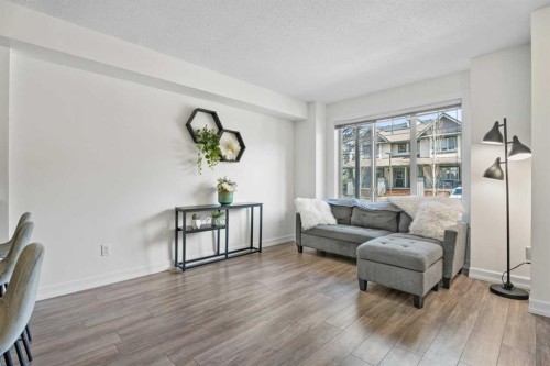 410-121 Copperpond Common Se, Calgary, AB - Indoor Photo Showing Living Room
