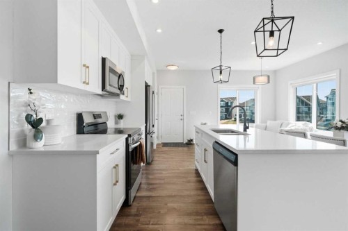 362 Canals Crossing Sw, Airdrie, AB - Indoor Photo Showing Kitchen With Double Sink With Upgraded Kitchen
