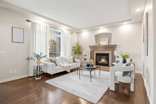 35 Tuscany Estates Crescent Nw, Calgary, AB - Indoor Photo Showing Living Room With Fireplace