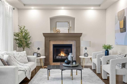35 Tuscany Estates Crescent Nw, Calgary, AB - Indoor Photo Showing Living Room With Fireplace