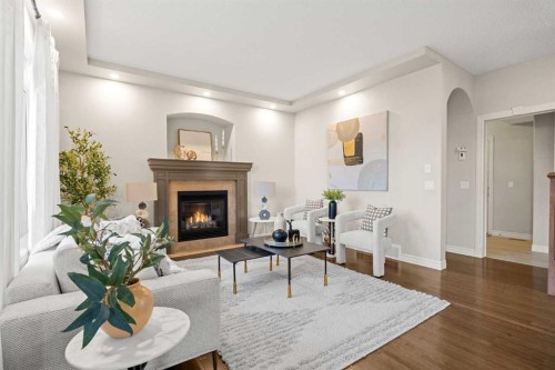35 Tuscany Estates Crescent Nw, Calgary, AB - Indoor Photo Showing Living Room With Fireplace