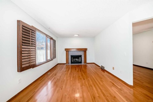 164 Macewan Park Circle Nw, Calgary, AB - Indoor Photo Showing Living Room With Fireplace