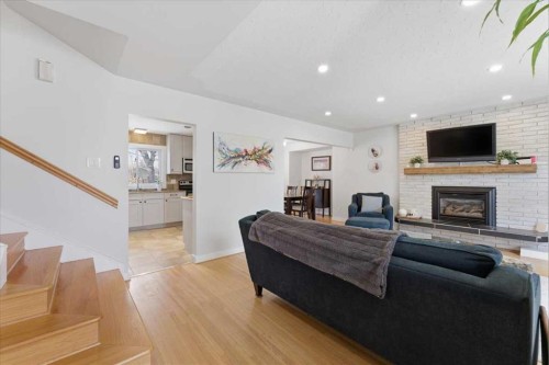 40 Grafton Crescent Sw, Calgary, AB - Indoor Photo Showing Living Room With Fireplace