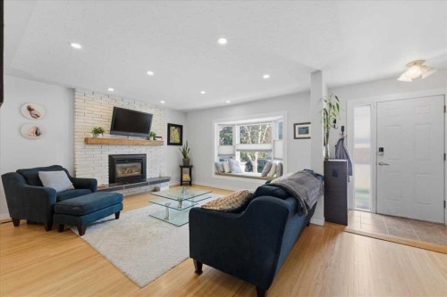 40 Grafton Crescent Sw, Calgary, AB - Indoor Photo Showing Living Room With Fireplace