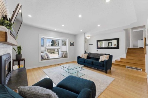 40 Grafton Crescent Sw, Calgary, AB - Indoor Photo Showing Living Room With Fireplace