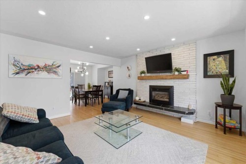 40 Grafton Crescent Sw, Calgary, AB - Indoor Photo Showing Living Room With Fireplace