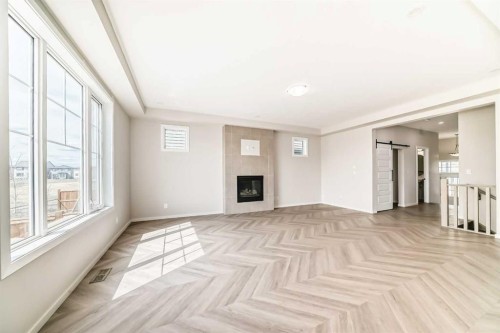 641 Windrow Manor Sw, Airdrie, AB - Indoor With Fireplace