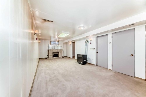 1527 49 Street Se, Calgary, AB - Indoor Photo Showing Other Room With Fireplace