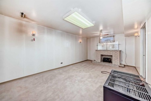 1527 49 Street Se, Calgary, AB - Indoor With Fireplace