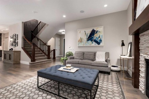 64 Mystic Ridge Way Sw, Calgary, AB - Indoor Photo Showing Living Room With Fireplace