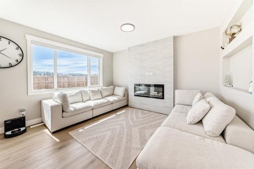 80 Vantage Drive, Cochrane, AB - Indoor Photo Showing Living Room With Fireplace