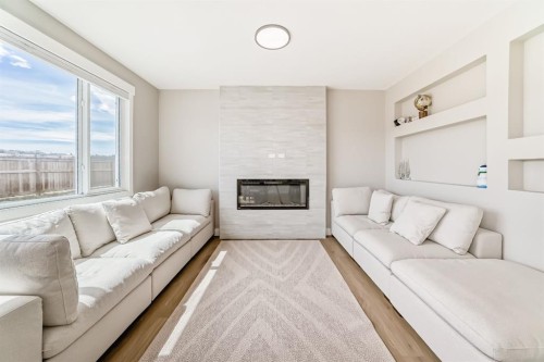 80 Vantage Drive, Cochrane, AB - Indoor Photo Showing Living Room With Fireplace