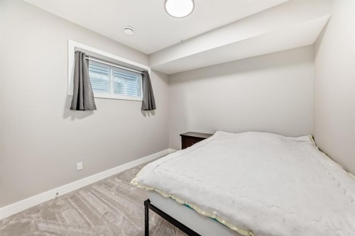 80 Vantage Drive, Cochrane, AB - Indoor Photo Showing Bedroom