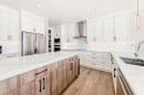80 Vantage Drive, Cochrane, AB  - Indoor Photo Showing Kitchen With Double Sink With Upgraded Kitchen 