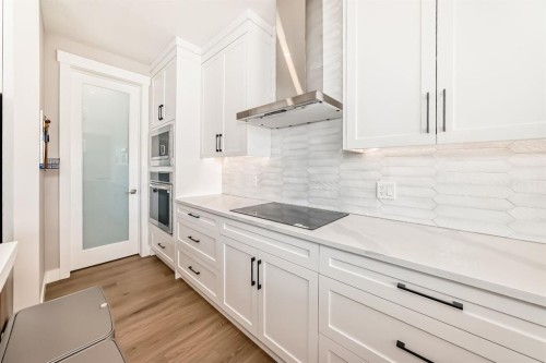 80 Vantage Drive, Cochrane, AB - Indoor Photo Showing Kitchen With Upgraded Kitchen