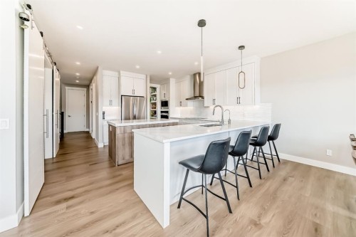 80 Vantage Drive, Cochrane, AB - Indoor Photo Showing Kitchen With Upgraded Kitchen