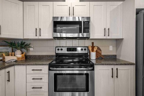 1311-1311 Hawksbrow Point Nw, Calgary, AB - Indoor Photo Showing Kitchen