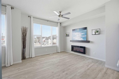 101 New Brighton Walk Se, Calgary, AB - Indoor Photo Showing Living Room With Fireplace