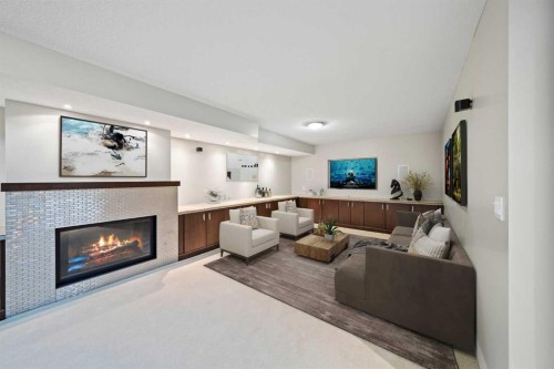 159 Malibou Road Sw, Calgary, AB - Indoor Photo Showing Living Room With Fireplace
