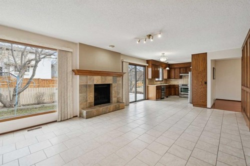 40 Scenic Place Nw, Calgary, AB - Indoor Photo Showing Living Room With Fireplace