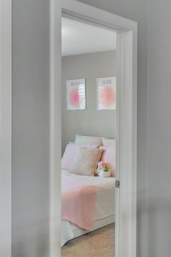 52 West Coach Court Sw, Calgary, AB - Indoor Photo Showing Bedroom