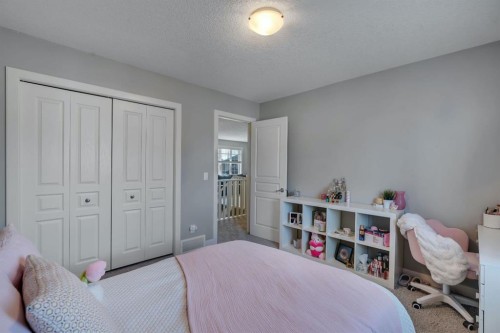 52 West Coach Court Sw, Calgary, AB - Indoor Photo Showing Bedroom